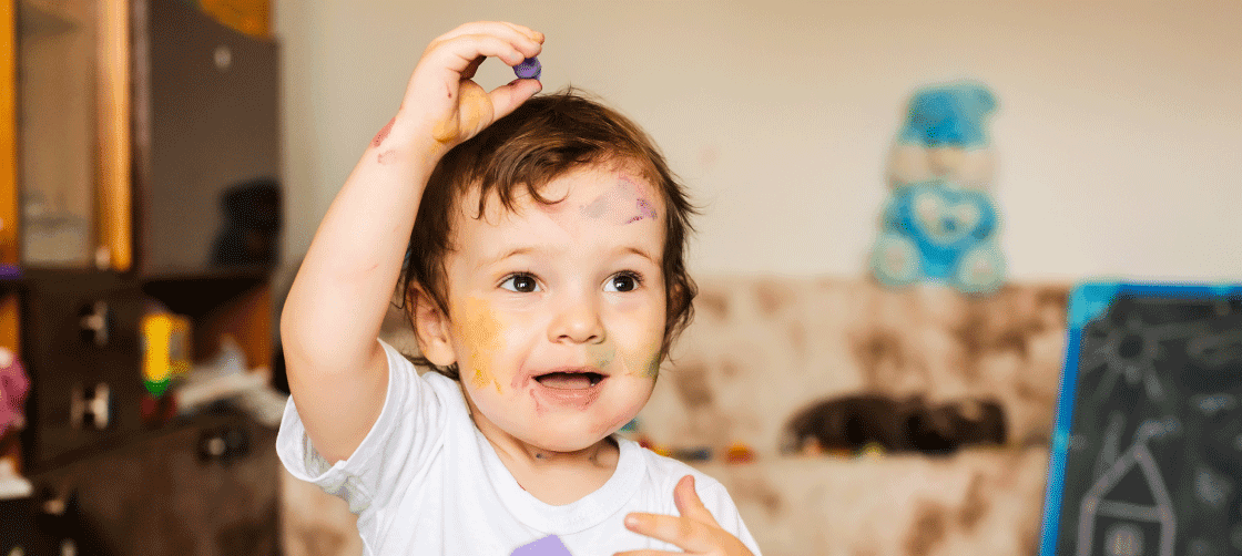 A child with paint on their face